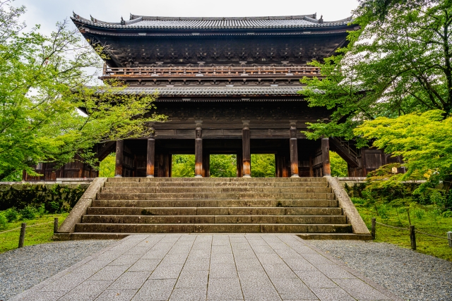 Sanmon Gate of Nanzen-ji Temple in Kyoto surrounded by lush greenery